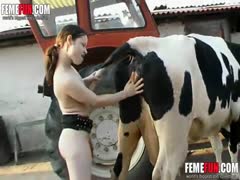 Slut pissing outdoors and playing with the cow s tits in a mind blowing beastiality video